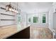 Sun-filled dining area showcases hardwood floors, table and chairs, granite countertop, and open shelving at 1096 Polo Club Nw Dr, Marietta, GA 30064