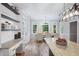 Bright dining area with large windows, hardwood floors, and built-in shelving and granite-topped cabinets at 1096 Polo Club Nw Dr, Marietta, GA 30064