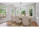 Dining area featuring large windows with natural light, a table, chairs, and patio access at 1096 Polo Club Nw Dr, Marietta, GA 30064
