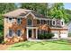 Charming brick home with two-car garage, manicured lawn, and inviting front entrance at 1096 Polo Club Nw Dr, Marietta, GA 30064