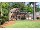 Traditional brick home with a manicured lawn and two-car garage is located in a desirable neighborhood at 1096 Polo Club Nw Dr, Marietta, GA 30064