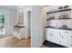 Functional butler's pantry with stylish cabinets, dark countertops, and open shelving at 1096 Polo Club Nw Dr, Marietta, GA 30064