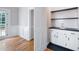 Functional butler's pantry with stylish cabinets, dark countertops, and sleek finishes at 1096 Polo Club Nw Dr, Marietta, GA 30064