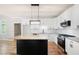 Modern kitchen features sleek white cabinetry, stainless steel appliances, granite counters, and central island at 1096 Polo Club Nw Dr, Marietta, GA 30064