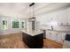 Open-concept kitchen with island, granite countertops, and adjacent dining space perfect for entertaining at 1096 Polo Club Nw Dr, Marietta, GA 30064