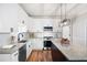 Beautiful kitchen features white cabinets, granite countertops, stainless steel appliances, and center island at 1096 Polo Club Nw Dr, Marietta, GA 30064