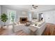 Inviting living room with cozy fireplace, ample seating, and bright natural light at 1096 Polo Club Nw Dr, Marietta, GA 30064