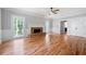Spacious and bright living room featuring beautiful hardwood floors and a classic fireplace at 1096 Polo Club Nw Dr, Marietta, GA 30064