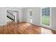 Spacious living room with hardwood floors, bright windows, and elegant trim work at 1096 Polo Club Nw Dr, Marietta, GA 30064