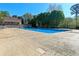 Spacious pool area offers a refreshing retreat with a concrete deck for lounging and enjoying the sun at 1096 Polo Club Nw Dr, Marietta, GA 30064