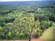 Secluded homesite nestled in a canopy of mature trees on a sprawling lot with great privacy at 12208 Buchanan Hwy, Temple, GA 30179