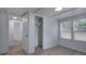 Bedroom with wood-look flooring, neutral walls, and closet with built-in shelving at 12208 Buchanan Hwy, Temple, GA 30179