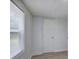 Bedroom featuring neutral paint, wood-look flooring, window, and closet at 12208 Buchanan Hwy, Temple, GA 30179