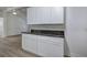 View of the kitchen featuring white cabinets and gray stone countertops at 12208 Buchanan Hwy, Temple, GA 30179