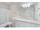 Bright bathroom features tub with shower, granite counter, and great lighting at 1731 Twin Brooks Se Dr, Marietta, GA 30067