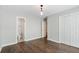 Bedroom with hardwood floors and an ensuite bathroom, providing comfort and privacy at 1731 Twin Brooks Se Dr, Marietta, GA 30067