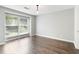 Inviting bedroom featuring hardwood floors, large windows, and ample natural light at 1731 Twin Brooks Se Dr, Marietta, GA 30067