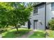 Gray painted brick home with front lawn and mature tree at 1731 Twin Brooks Se Dr, Marietta, GA 30067