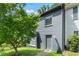 Gray painted brick home with front lawn and mature tree at 1731 Twin Brooks Se Dr, Marietta, GA 30067