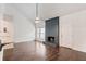 Bright living room with fireplace, wood floors, and breakfast bar, perfect for entertaining at 1731 Twin Brooks Se Dr, Marietta, GA 30067