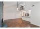 Spacious living room with hardwood floors, a brick fireplace, and a breakfast bar that opens to the kitchen at 1731 Twin Brooks Se Dr, Marietta, GA 30067