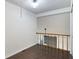 Cozy loft space with wood floors and views of the living area below and brick fireplace at 1731 Twin Brooks Se Dr, Marietta, GA 30067