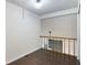 Upstairs loft area with hardwood floors and balcony views at 1731 Twin Brooks Se Dr, Marietta, GA 30067