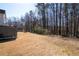 A spacious backyard with green grass, mature trees, and room for outdoor activities, adding natural beauty at 3519 Wellsley Dr, Powder Springs, GA 30127