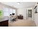 Home office with a large window offering natural light and adjacent access to another room at 3519 Wellsley Dr, Powder Springs, GA 30127