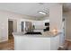Well-lit kitchen features stainless steel appliances, granite countertops, white cabinetry, and hardwood floors at 3519 Wellsley Dr, Powder Springs, GA 30127