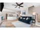 Open-concept living room boasts hardwood floors, ceiling fan and staircase to the second floor at 3519 Wellsley Dr, Powder Springs, GA 30127