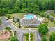 Aerial view of the community pool with splash pad, clubhouse, and playground at 6460 Valley Crossing Way, Cumming, GA 30028