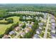 Wide aerial view of the neighborhood featuring tree-lined streets and well-kept homes at 6460 Valley Crossing Way, Cumming, GA 30028