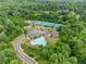 Aerial view of the community clubhouse, pool, tennis and pickleball courts at 6460 Valley Crossing Way, Cumming, GA 30028