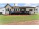 Expansive backyard with a spacious deck, lush lawn, and inviting outdoor space at 6460 Valley Crossing Way, Cumming, GA 30028
