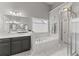 Bathroom with double sink vanity, soaking tub, and glass shower at 6460 Valley Crossing Way, Cumming, GA 30028