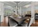 Open concept dining room and living area with coffered ceilings at 6460 Valley Crossing Way, Cumming, GA 30028