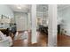 Spacious foyer with views to open dining and living spaces features elegant craftsman trim at 6460 Valley Crossing Way, Cumming, GA 30028