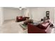 Spacious living room with tile flooring and comfortable leather furniture at 6460 Valley Crossing Way, Cumming, GA 30028