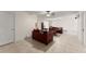 Large living room with leather furniture, rug and ceiling fans at 6460 Valley Crossing Way, Cumming, GA 30028