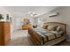 Inviting main bedroom with wood furniture, ceiling fan, and natural light at 6460 Valley Crossing Way, Cumming, GA 30028