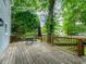 Spacious backyard deck perfect for outdoor dining and entertaining with mature trees at 740 Orchard Ct, Atlanta, GA 30328