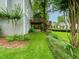 Lush backyard showcasing green lawn, mulched planting beds, and home's exterior at 740 Orchard Ct, Atlanta, GA 30328