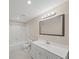 Bathroom with white vanity, a large mirror, and combined tub and shower at 740 Orchard Ct, Atlanta, GA 30328