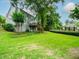Well-maintained home with a sprawling green lawn, wooden deck, and mature trees at 740 Orchard Ct, Atlanta, GA 30328