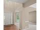 Bright foyer with hardwood floors that flows to carpeted living room with large windows at 740 Orchard Ct, Atlanta, GA 30328