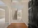 Inviting foyer with hardwood flooring, a staircase, and a view into the living spaces at 740 Orchard Ct, Atlanta, GA 30328