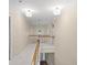 Second story hallway with a railing and view overlooking the front entrance of the house at 740 Orchard Ct, Atlanta, GA 30328