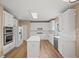 Modern kitchen featuring stainless appliances, white cabinetry, and a center island at 740 Orchard Ct, Atlanta, GA 30328