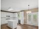 Bright kitchen boasts white cabinets, stainless steel appliances and hardwood floors at 740 Orchard Ct, Atlanta, GA 30328